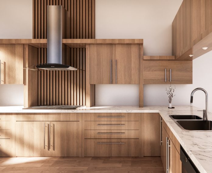 Beige cabenets of different sizes and heights frame the corner of a kitchen. Stunning marble countertops the corner with a stainless steel sink.